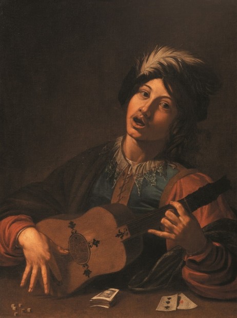 ANONYMOUS - Man playing guitar and singing