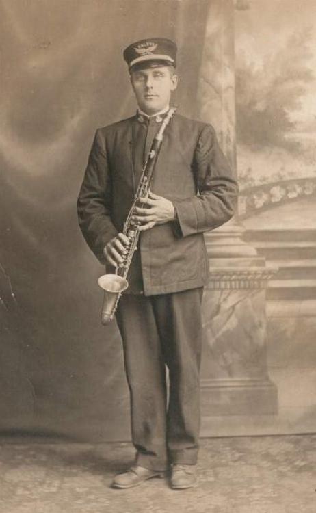 ANONYMOUS - Man holding alto clarinet