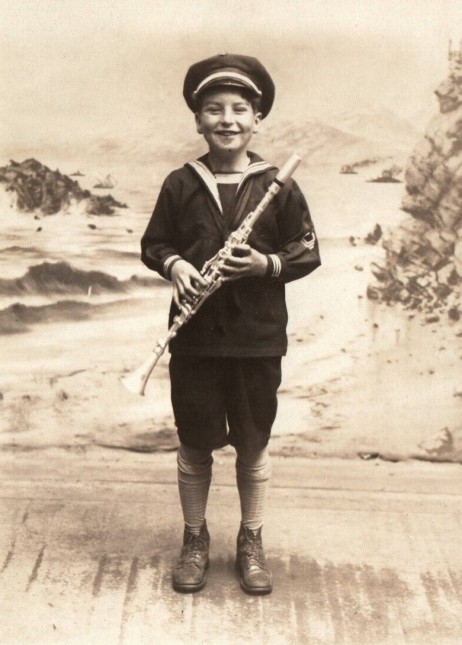 ANONYMOUS - Kid US Navy holding a metal clarinet 