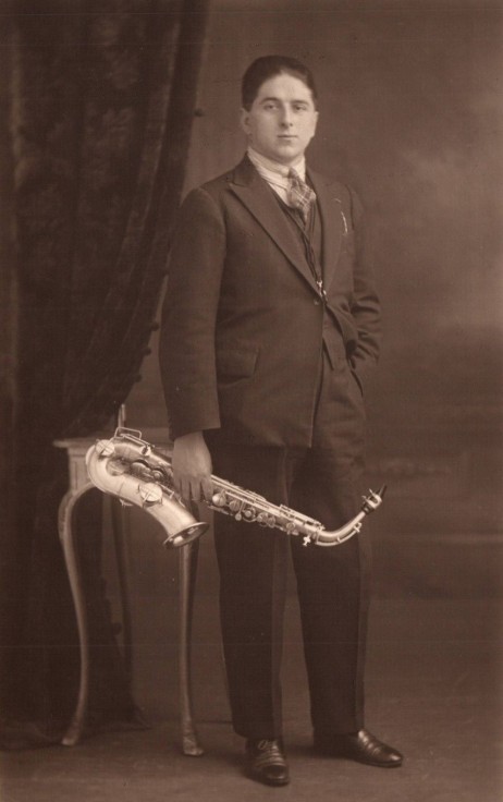 ANONYMOUS - Man holding saxophone 